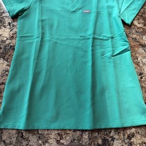 3 FIGS scrub pants size small, 4 FIGS scrub shirts size XS.